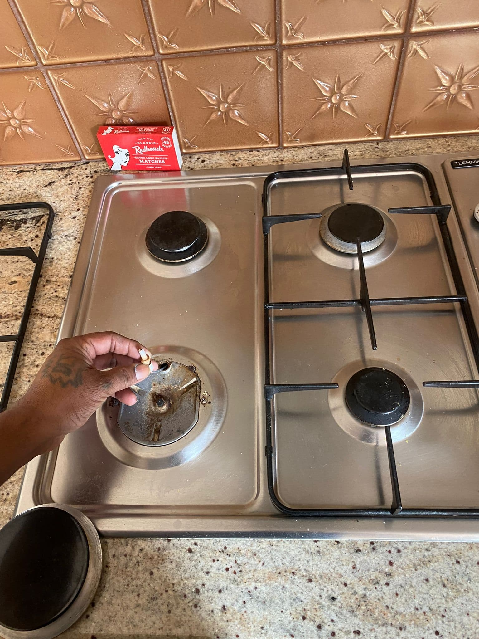 Gas cooktop burner inspection and repair